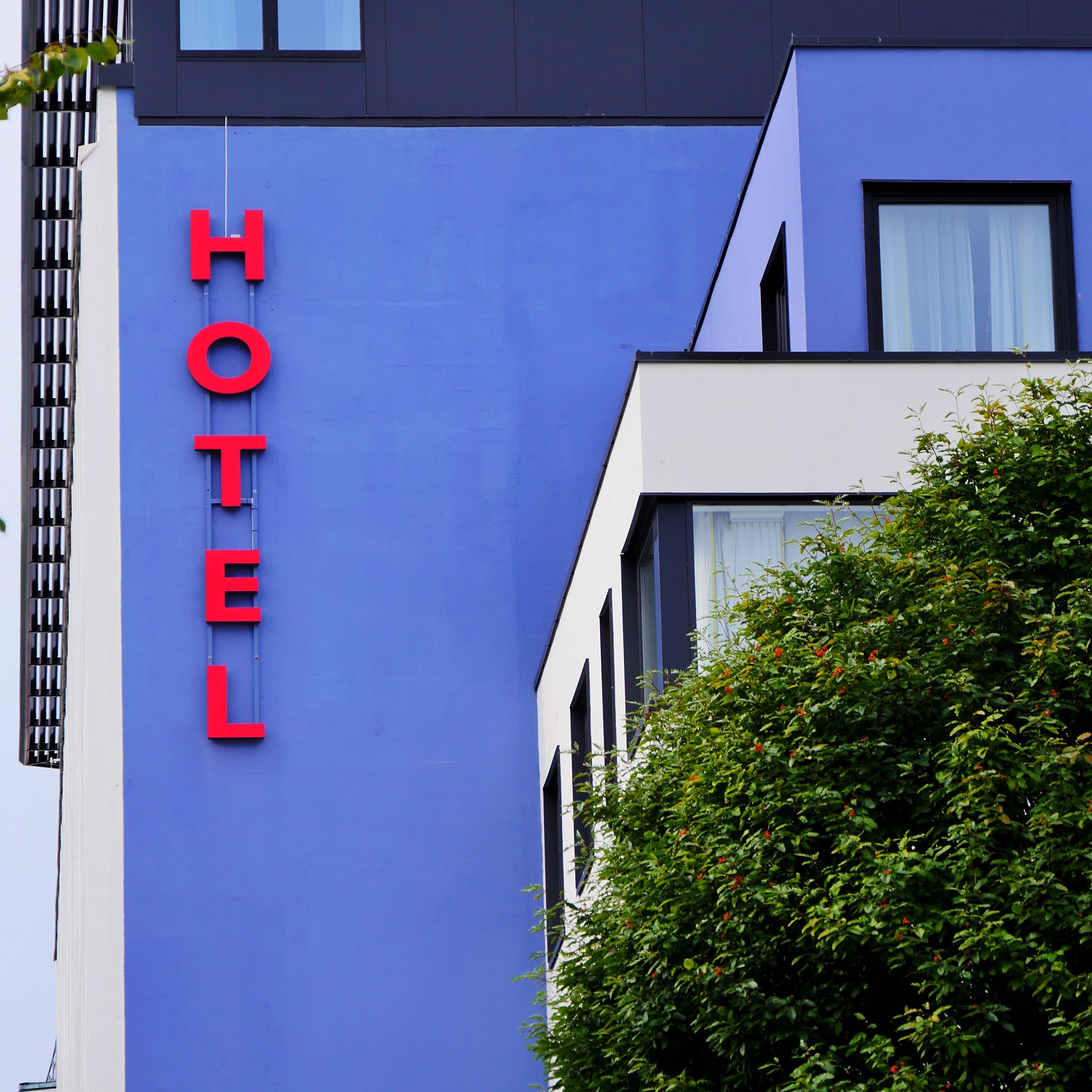 low angle view building against blue sky min